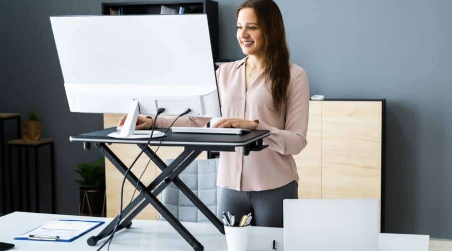 Woman Standing at Desk
