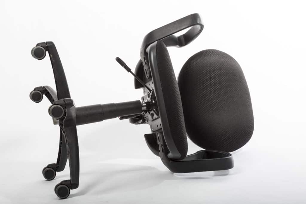 Black office chair on wheels broken